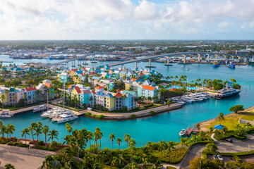 Naklejka na ściany i meble Harborside Villas aerial view at Nassau Harbour with Nassau downtown at the background, from Paradise Island, Bahamas.