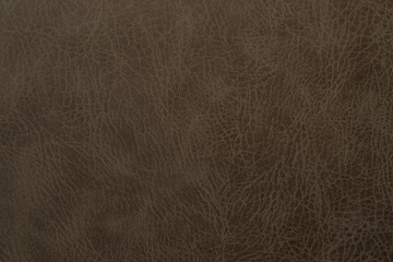 brown artificial leather with waves and folds on PVC base