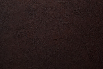 brown artificial leather with waves and folds on PVC base