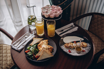 still life with juice and cheese toasts breakfast rose