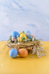 Fototapeta na wymiar Easter eggs in nest