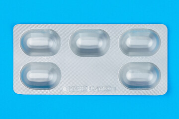 Blister or pack of five tablets or pills. The concept of five working days. Classic medical blue...