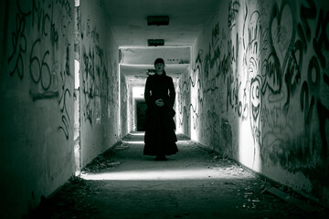 Horror scene of scary woman in derelict hallway