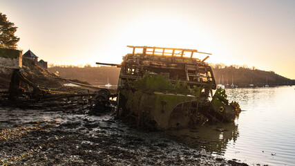 wreck of an old boat on a beach in Brittany, France