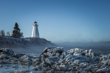 Green's Point Lighthouse in L'Etete Saint George New Brunswick Canada - Winter frozen landscape cold
