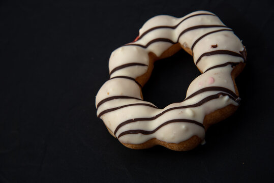 DonutDelicious donut with caramel glazed, Isolated on white and wood background. High quality photo