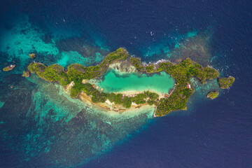 A lake within an island. High angle shot of a little islets and islands in the middle of Indonesia.