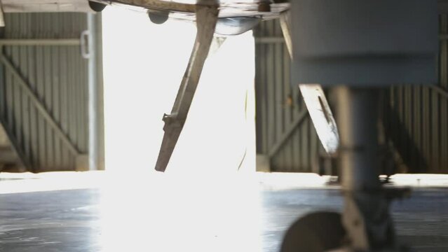 Low Angle View on an Old Military Aircraft in Hangar.  