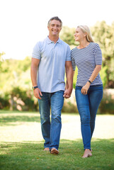 I appreciate all that you are. Full length portrait of mature couple walking hand-in-hand in the park.