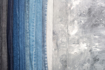 shades of different jeans on a gray background.