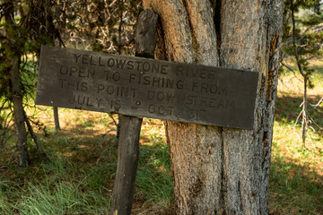 Fishing Season Sign Near Fishing Bridge In Yellwostone