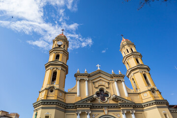 Facade of an old colonial cathedral under the blue sky of Piura in Peru.