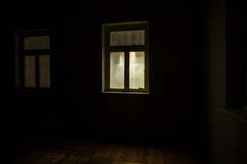 Fototapeta na wymiar Night scene of moon seen through the window from dark room. Realistic dollhouse miniature decorated.
