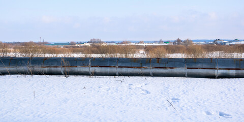Air heating main against  the background  of a winter landscape