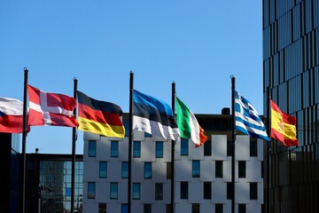 Group of EU memberstate flags waving in wind Court of Justice building in Luxembourg: Denmark,...