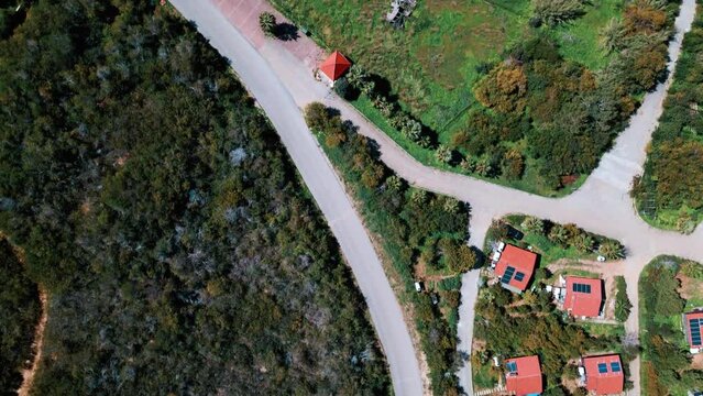 Aerial 4k top view of houses in nature next to beach in North Cyprus