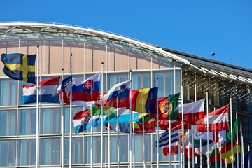 Group of EU memberstate flags flying in wind by EIB building in Luxembourg - obrazy, fototapety, plakaty