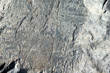 Patterns of rocks shells, rope and grass