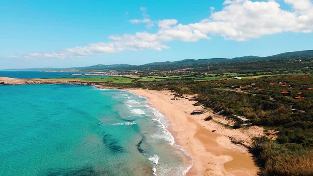Aerial 4k Sandy Beach with crystal clear water and sandy coastline in North Cyprus, which offer you tropical exotic beach feeling with its natural untouched beauty in Cyprus Island.