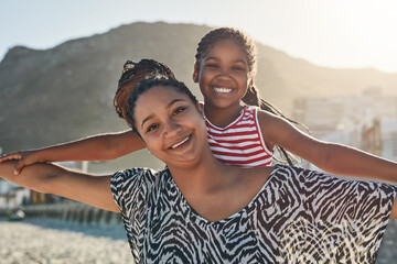 This is how much fun were having. Portrait of a mother and her little daughter enjoying some quality time together at the beach.