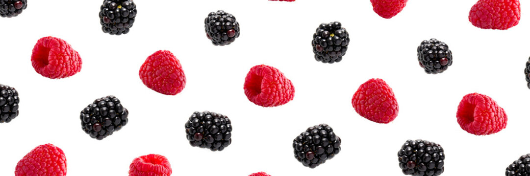 Raspberries abstract background. Fruit pattern of colorful wild berries isolated on white background. Raspberries, blackberry and brumble. Top view. Flat lay banner
