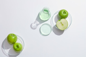 Top view of green apple decorated in petri dish in white background for advertising 