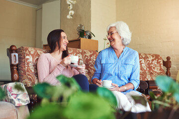 Granny loves sharing her stories of the past. Cropped shot of a senior woman and her granddaughter...