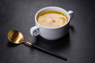 Fresh pea soup in bowl on black background. Cooking at home
