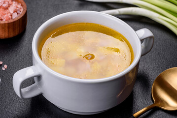 Fresh pea soup in bowl on black background. Cooking at home