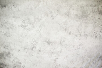 Obraz na płótnie Canvas White grunge cement or concrete painted wall texture. The white concrete stone. concrete plastered stucco wall painted. White abstract gray background concrete texture for interior design.