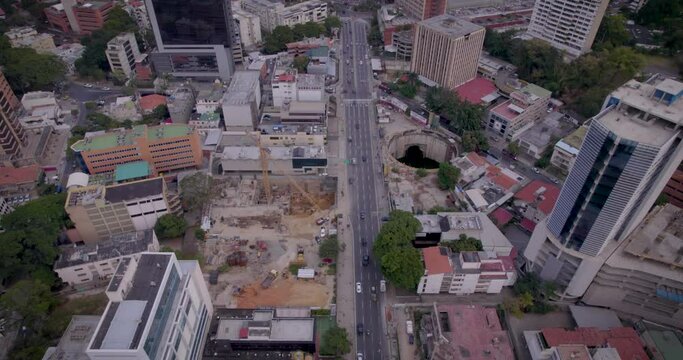 Aerial view flying over the Avenida Principal in Las Mercedes, Caracas, Venezuela, looking to the Tamanaco Hotel at the end of it.