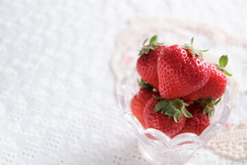 strawberries in a glass container