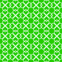 Fototapeta premium St.Patrick's Day. White clover leaves on green background pattern. White heart shape pattern on green backdrop.