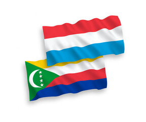 Flags of Union of the Comoros and Luxembourg on a white background
