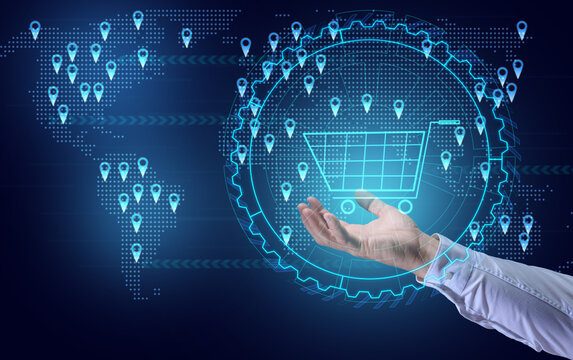 a man's hand holds a virtual shopping cart against the background of a world map with points of sale. Internet sales concept, profit growth due to market expansion