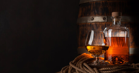 Glass and bottle with cognac