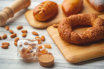 Various freshly baked sweet buns on wooden background