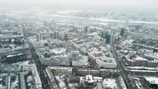 The city in Russia is Novosibirsk. A winter town in a snowstorm. Aerial photography of cities.