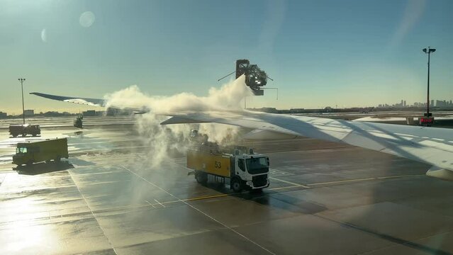Anti-Icing Fluids Sprayed on an Airplane Wing to Remove Frost and Snow - Fixed Shot