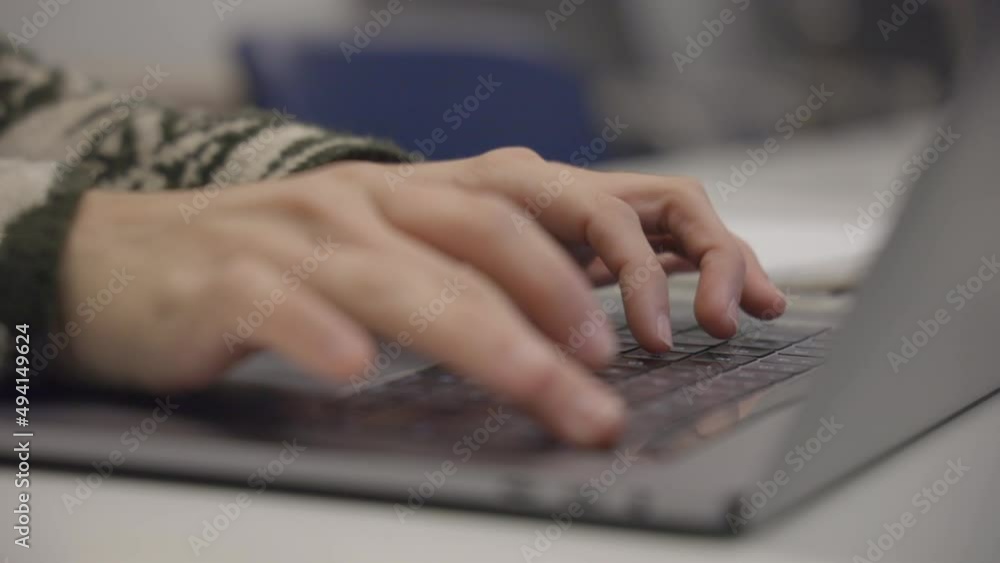 Poster man hands working and typing on laptop computer keyboard, close up