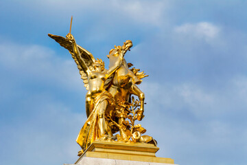 Fototapeta na wymiar Golden Fame Winged Horse Statue on Pont Bridge Alexandre III in Paris ,France