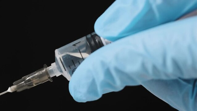 Hand with syringe