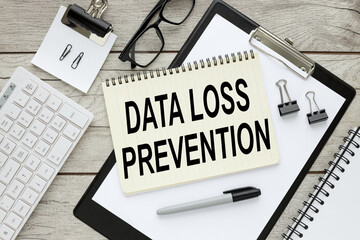 Data Loss Prevention notepad with text on black folder with clip