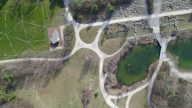 Aerial view of Z&uuml;rich University Campus Irchel witch park and pond on a sunny spring day. Movie shot March 21st, 2022, Zurich, Switzerland.