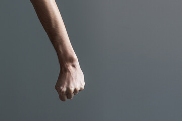 view of the fist of an aggressive man committing domestic violence. Brutality and aggression...