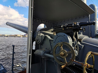 Russia, St. Petersburg - August 2020. Cannon on the cruiser Aurora and View of the Neva and...