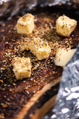 Tomahawk steak with seasoning and at the butter