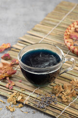 Blue matcha tea in a glass cup