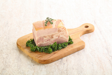 Cut of pork bacon over board