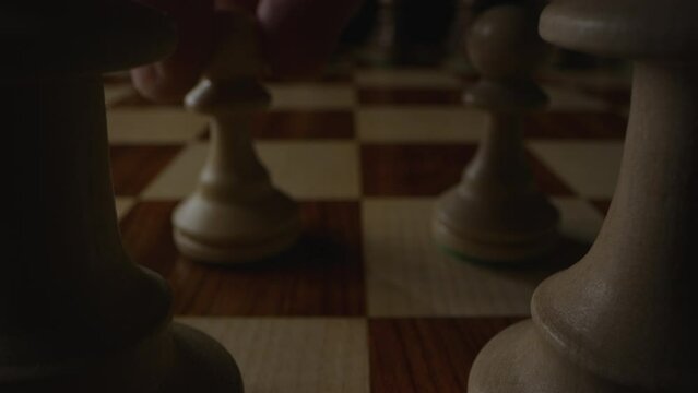 Queen&rsquo;s pawn is moved to chess space D4 in strategic opening move. Static shot. Close up.